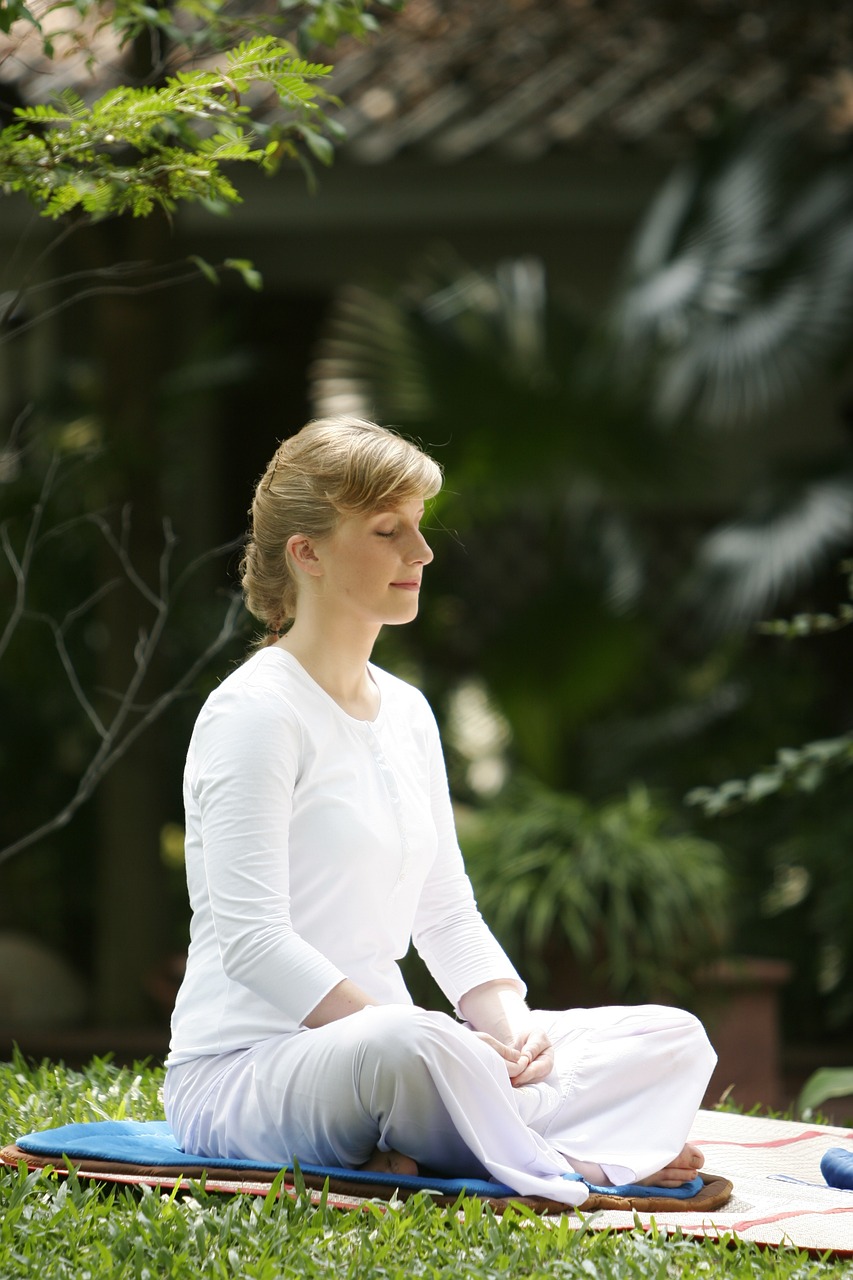 Image of a person meditating in a peaceful setting